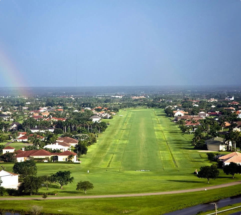 A vein treatment center near a grassy airstrip in Boca Raton neighborhood homes.